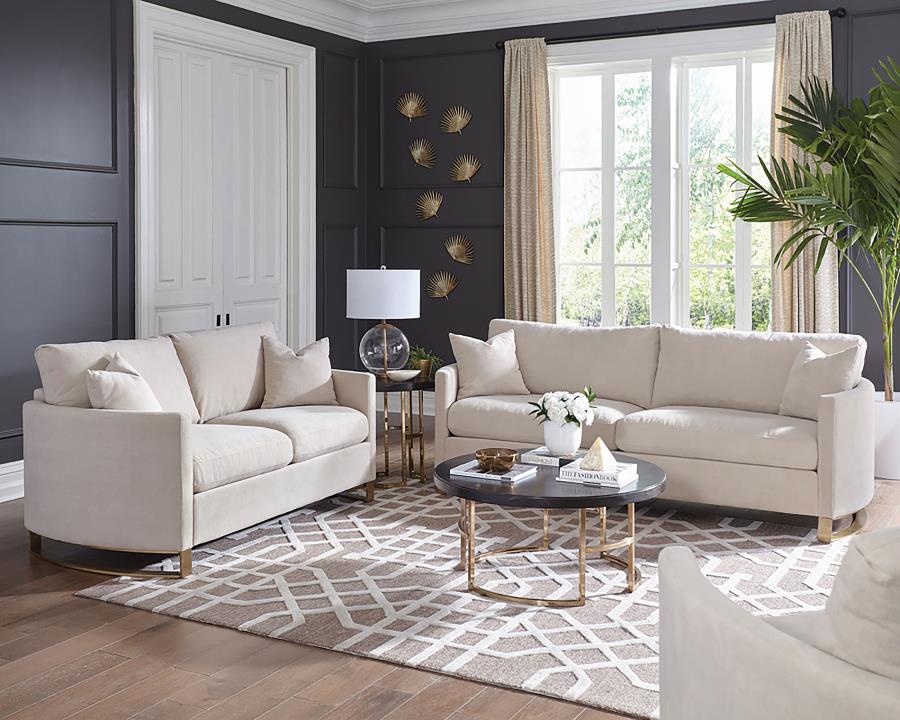 Blue velvet Steve Silver stationary sofa in a bright living room